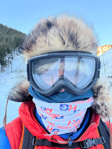Mark Pattison in winter mountaineering gear with a Higher Ground branded neck gaiter